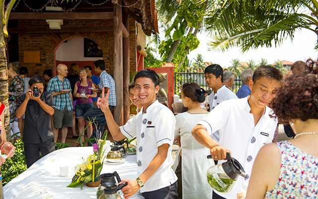 Staff at the hotel at the tea stand